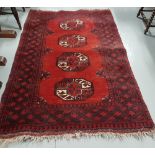Persian wool ground red rug, bacarra pattern on a woollen back, 1.85m x 1.05m