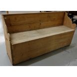 Irish antique pine settle bed, with curved side arms and drop- down front panel, 72"w x 35"h x 20"d