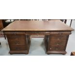 Carved oak kneehole partner's desk, with 3 apron drawers over 3 small drawers, with masked