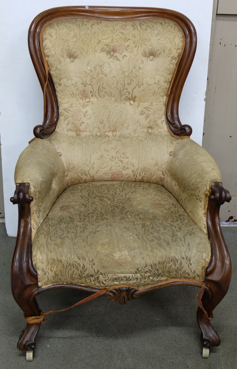 Late 19th Century Mahogany framed library armchair, curved back with scrolled arms and similar