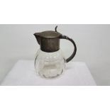 Bulbous glass ewer with a plated top &