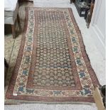 2 wool floor rugs, red ground (worn)