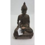 Metal Figure of a seated deity, 9”h