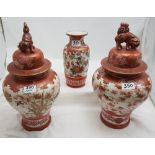 Matching pair of Japanese Imari bulbous vases, decorated on red ground pattern of birds and floral