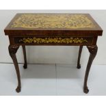 Marquetry Inlaid Games Table, on sabre legs, the top folding over to a games board, 32”w, opens to