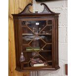 Late 19thC Mahogany Hanging Corner Cabinet, with a swan neck top over a single astragal glazed door,