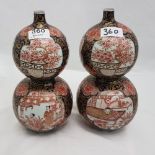 Matching pair of early 20th C double gourd Japanese vases, continuous pattern of floral trees