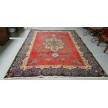 Red ground Persian Tabriz Carpet, with a unique floral medallion design, 2.40 x 3.80