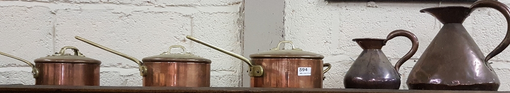 Set of 3 graduating Castle Brand Saucepans (as new) and two graduating Copper Pub Measures (5)