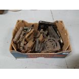 Small box metal items – old clothes irons, trivets and internal door locks