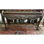 Early 20th Mahogany Centre Table, the rectangular and rimmed border table top above a raised mask of