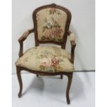 Mid 20th C French Armchair with a floral linen padded back and seat and a green velour padded