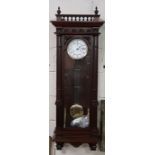 Spring driven Vienna wall clock, in a mahogany case, German movement, 50”h