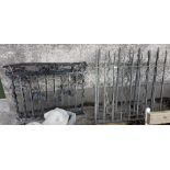 Two pairs of cast iron Railings, both 4ft w x 42”h – 1 with a spiked top, 1 with shamrock designs (