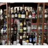 3 shelves of bottled spirits, including Moet and Chandon champagne magnum (2000), Cork gin, 3 x