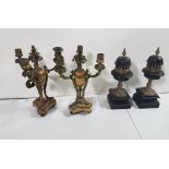 Pair of clock candelabra garniture, beige marble centre and a pair of black slate clock garniture,