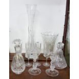 10 cut glass items – Galway lily vase, Waterford vase (chip on rim), 2 decanters, 4 flutes and