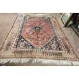 Persian Wool Floor Rug, red ground with multiple brown, red, navy ground borders, on a wool back,