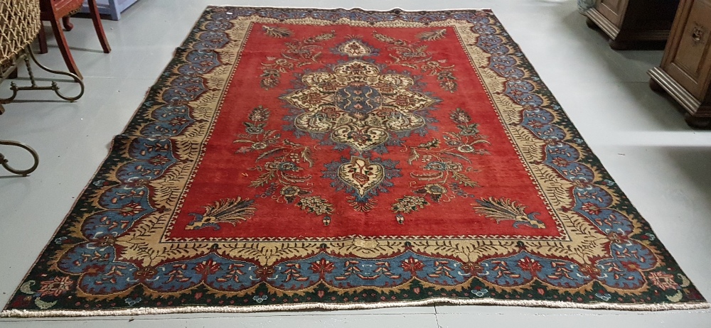 Red ground Persian Tabriz Carpet, with a unique floral medallion design, 2.40 x 3.80 - Image 2 of 2