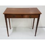 Mahogany Hall Table, the inlaid rectangular top over 2 apron drawers, on tapered legs, circular