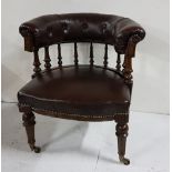 WMIV Oak Framed Library Armchair, the brown leatherette and button detail bow-shaped chair back over