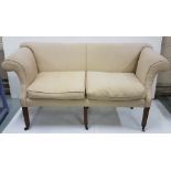 Regency Sofa, the high scroll-shaped side arms between two feather filled cushions, all