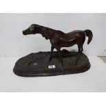 Spelter Figure of a Stallion, on a naturalistic oval base, 20”w x 10”h