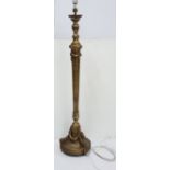 Late 19thC carved gilt wood Standard Lamp, electrified, the torch-shaped central column decorated