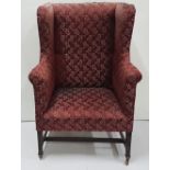 Early Georgian Gents Wing-back Library Armchair, upholstered with red satin fabric (worn), on square