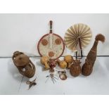 Tribal Items – 2 Fans, 4 x wooden percussion instruments, decorated bottle, 2 x pineapples & a “