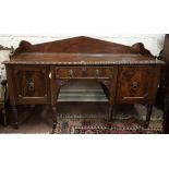 Regency Mahogany Sideboard, the triangular shaped gallery, above a rope edged Cuban mahogany top and