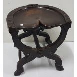 Carved Elm Stool, horseshoe shaped top impressed "Good Luck", with a cross scrolled stretcher, 17"