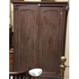 William IV mahogany wardrobe, arched panelled doors enclosing hanging robe and 2 internal drawers,