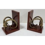 Matching pair of mahogany bookends mounted with brass goat head and curled horns (reproduction),