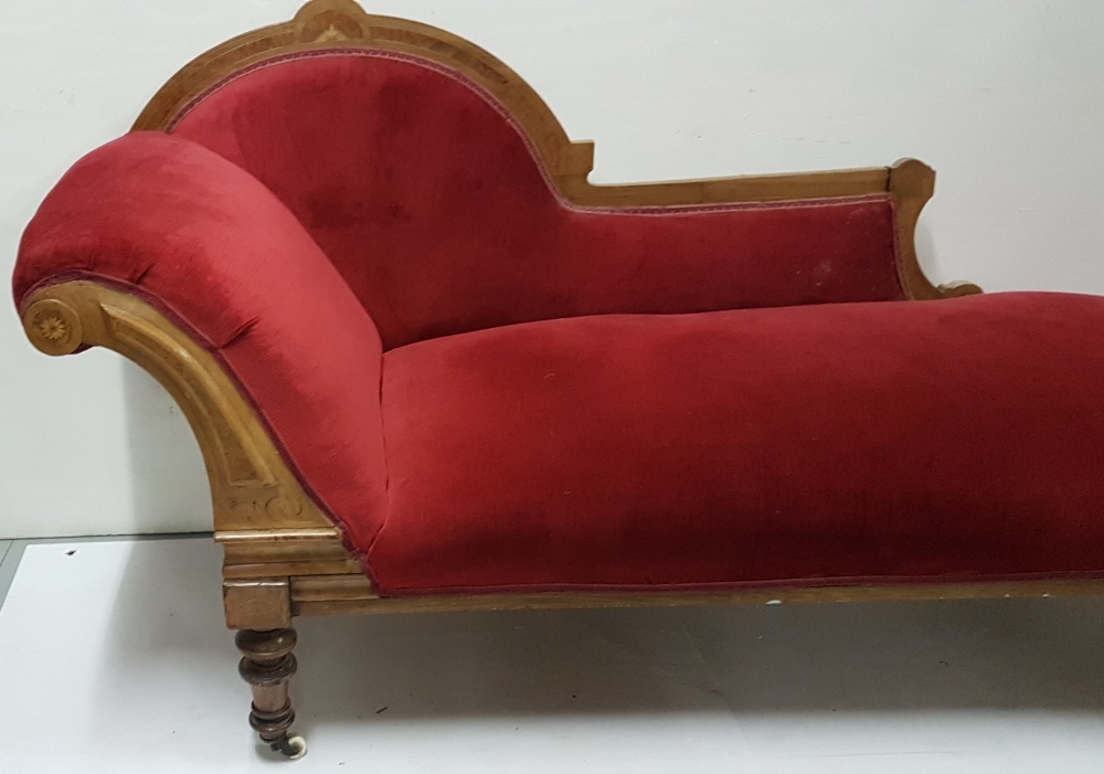 Victorian walnut framed Chaise Longe, with an arched inlaid back and turned legs and castors, red - Image 2 of 2