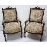 Matching Pair of 19th C French mahogany Salon Armchairs, wreath mouldings atop beige upholstered