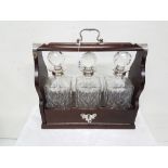 Mahogany and silver plated tantalus case including a set of 3 cut glass square shaped decanters with