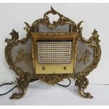 Electric Room Heater, in an ornate French Brass Frame, featuring cherub mounts, 30”w x 33”h