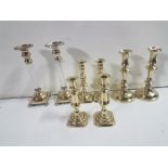 4 Pairs of Candlesticks incl. 3 solid brass and 1 with glass central columns