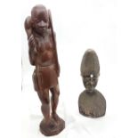 Carved African figure of a tribal chief, 14”h and a carved figure of an African hunter with his