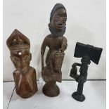 3 carved wooden African figures - a woman seated on a horse, 21”h, and 2 carved busts of tribal