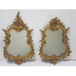 Matching Pair of early 19thC Carved Gilt Wood Wall Mirrors, the ornately carved pediments atop
