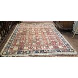 Persian Wool Floor Rug (of Indian origin), deep red ground with continuous patterns of vases and