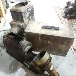 Old projector with brass framed lens, the original carrying case stamped E BARTON, CARLOW, also an