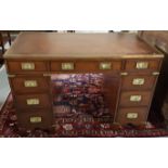 English Mahogany “Military” Kneehole Writing Desk, the brass banded desktop inset with tooled