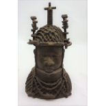 Bronze head and shoulders bust of a Benin Tribeswoman wearing a native headdress and neck jewellery,