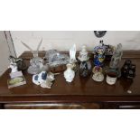 Shelf of ornaments, including Swedish glass wild animals, birds, horse figures, NAO dogs etc