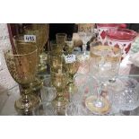 Pair of 19thC green wine glasses with gilt overlay and 3 matching smaller glasses (5) and