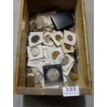 Wooden box of old Irish and English coins, some in mounts, including Churchill commemorative