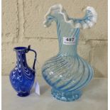 Blue Glass Ribbed Vase 11”h and a smaller deep blue glass vase with white overlay 7”h (2)